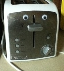 Toaster with googly eyes